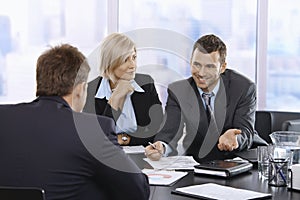 Businessman smiling at meeting