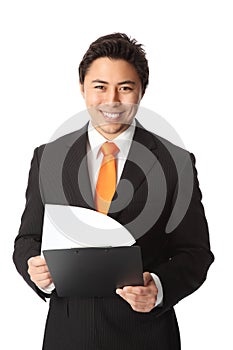 Smiling businessman with document