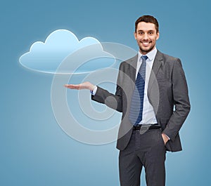 Smiling businessman holding cloud icon