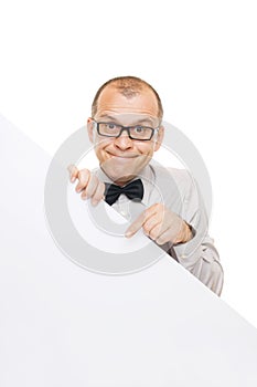 Smiling businessman holding white info board