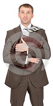 Smiling businessman hugging suitcase