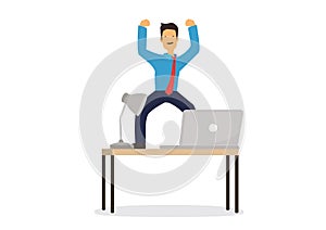 Smiling businessman jumping ofr joy on his office desk with a laptop