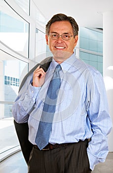 Smiling Businessman Leaving The Office