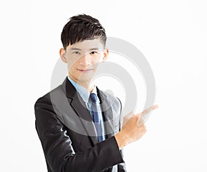 Smiling Businessman pointing copy space