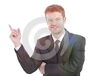Smiling businessman pointing copy space.