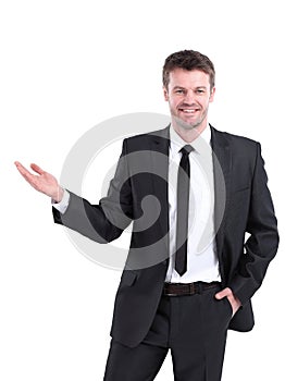 Smiling businessman pointing copy space.