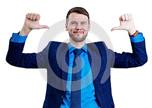 Smiling businessman pointing on himself by thumbs up gesture.