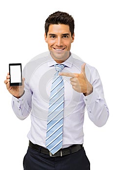 Smiling Businessman Pointing At Smart Phone