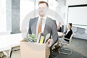 Smiling Businessman Quitting Job photo