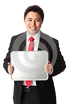 Smiling businessman showing blank board