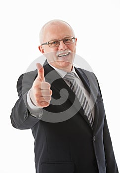 Smiling businessman showing thumb up sign