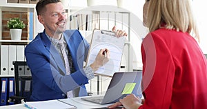 Smiling businessman shows resume blank to businesswoman 4k movie