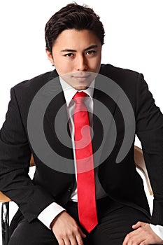 Smiling businessman sitting down