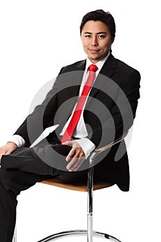 Smiling businessman sitting down