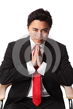 Smiling businessman sitting down