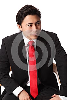 Smiling businessman sitting down