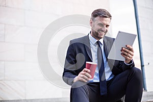 Smiling businessman after successful workday