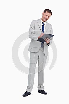 Smiling businessman taking notes