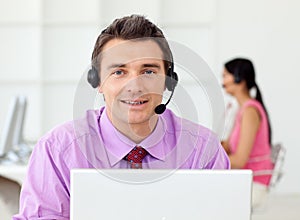 Smiling businessman talking on headset