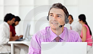 Smiling businessman talking on headset