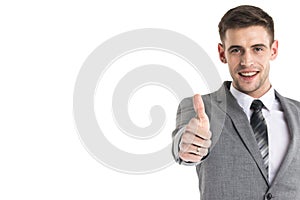 Smiling businessman with thumb up