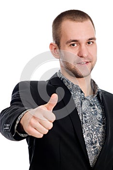 Smiling businessman with thumb up