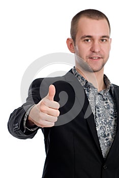 Smiling businessman with thumb up