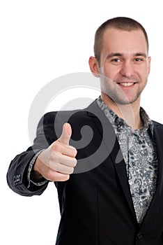 Smiling businessman with thumb up