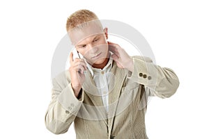 Smiling Businessman Using Phone