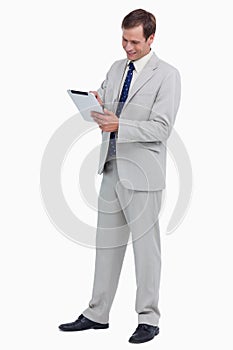 Smiling businessman using tablet computer