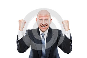 Smiling businessman winner gesturing raised hands fist celebrating victory achievement