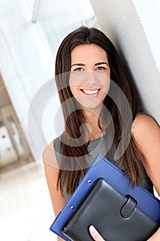 Smiling businesswoman with agenda