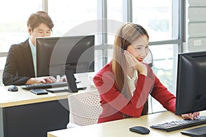 Smiling businesswoman Call Center or Technical Support staff or receptionist phone operator teamwork. Asian customer support team