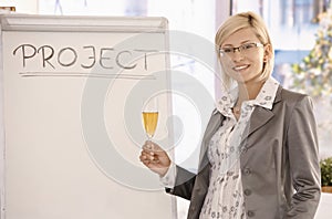 Smiling businesswoman with champagne