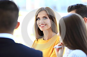 Smiling businesswoman with colleagues