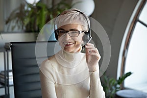 Smiling businesswoman consult client online on laptop