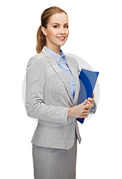 Smiling businesswoman with folder