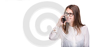 Smiling businesswoman in glasses talking on mobile phone. Beautiful young girl in white shirt on white isolated background talking