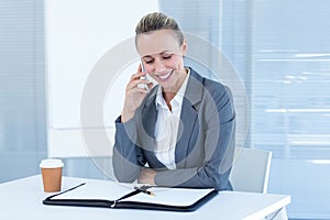 Smiling businesswoman having phone call