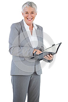 Smiling businesswoman holding her diary