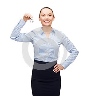 Smiling businesswoman with house keys