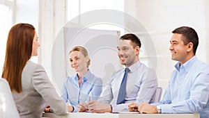 Smiling businesswoman at interview in office