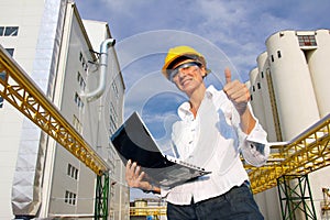 Smiling Businesswoman with Notebook