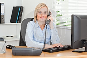 Smiling businesswoman on the phone