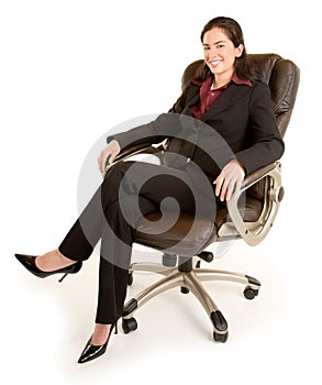 Smiling Businesswoman Sitting on a Leather Chair