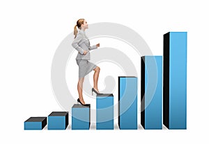 Smiling businesswoman stepping on chart bar