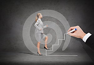 Smiling businesswoman stepping up staircase