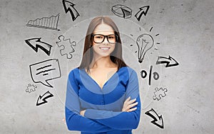 Smiling businesswoman or student in glasses