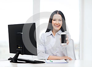 Smiling businesswoman or student with smartphone