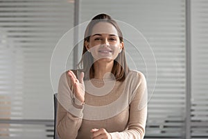 Smiling businesswoman talking looking at camera skyping for job interview